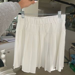 white pleated mini tennis skirt